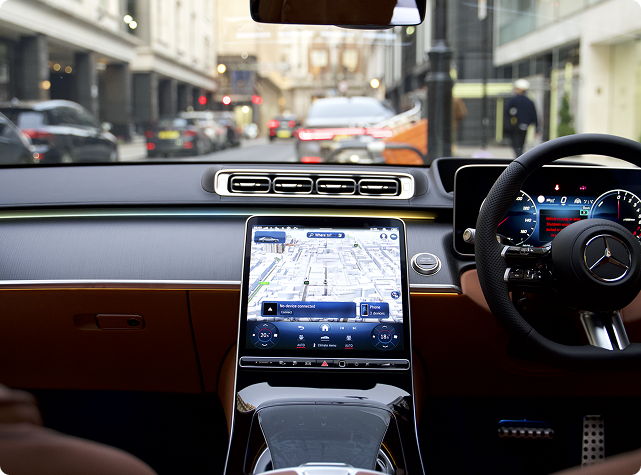 Chauffeur greeting a passenger in the arrivals hall